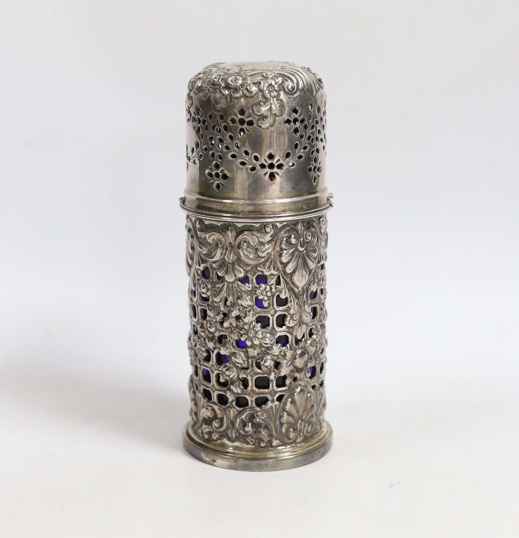 A late Victorian pierced silver lighthouse sugar caster, Horace Woodward & Co Ltd, London, 1898, with blue glass liner, 15.7cm.